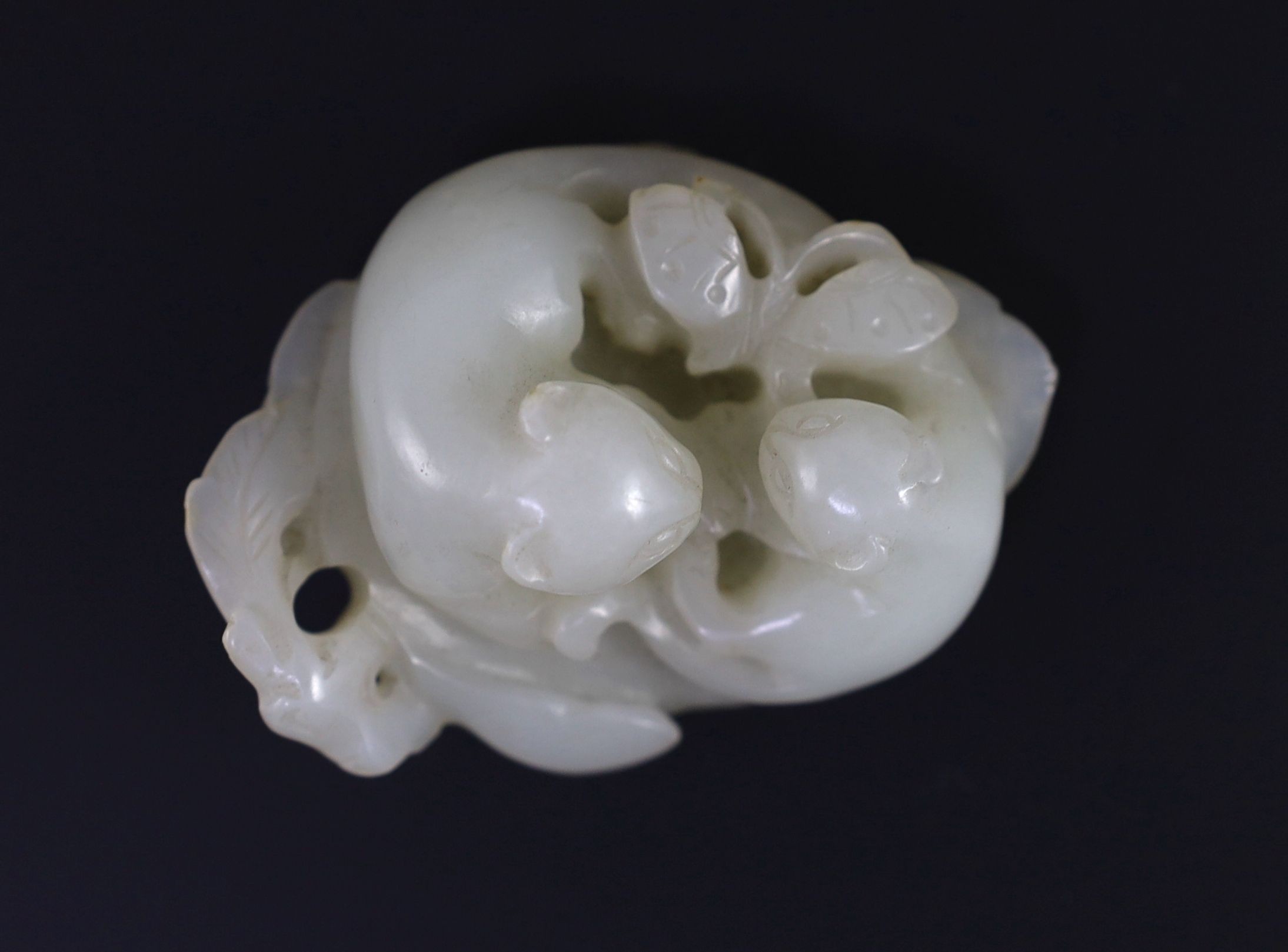 A Chinese pale celadon jade ‘cats and butterfly’ group, 18th/19th century, 6cm long